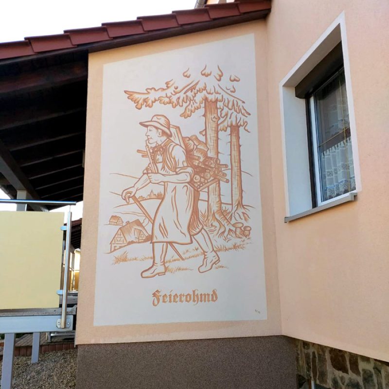 Wandmalerei „Feierohmd“ an einer Hausecke